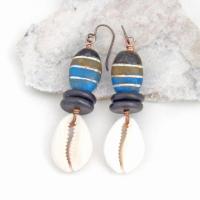These handmade earrings feature colorful blue, cocoa brown and black painted wood beads accented with cowrie shell dangles and black jasper beads. They have a bold, ethnic tribal flair and will make a unique statement.