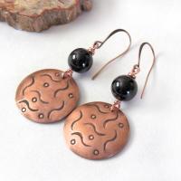 These handcrafted copper dangle earrings have a hand stamped texture and are accented with natural black onyx gemstones. They have a classic modern style that coordinates with all wardrobe types. They'll make a great gift for couples celebrating their 7th wedding anniversary - copper is the traditional metal and onyx is the traditional gemstone for this occasion.