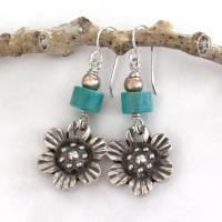 These handcrafted earrings feature silver tone pewter flowers accented with turquoise stones and round pewter beads. The flowers have a beautiful 3-dimensional design with lots of great detail. They'll make a great gift for a gardener, nature or flower lover.
