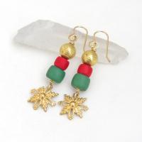 Full of elegant holiday charm, these handmade dangle earrings feature gold brass snowflake filigree charms accented with red and green glass beads topped off with textured gold brass beads. They have a modern charm with a boho chic style that's perfect for the holiday and Christmas season. They'll make a great gift for someone that loves handmade jewelry - or a nice addition to your own wardrobe.