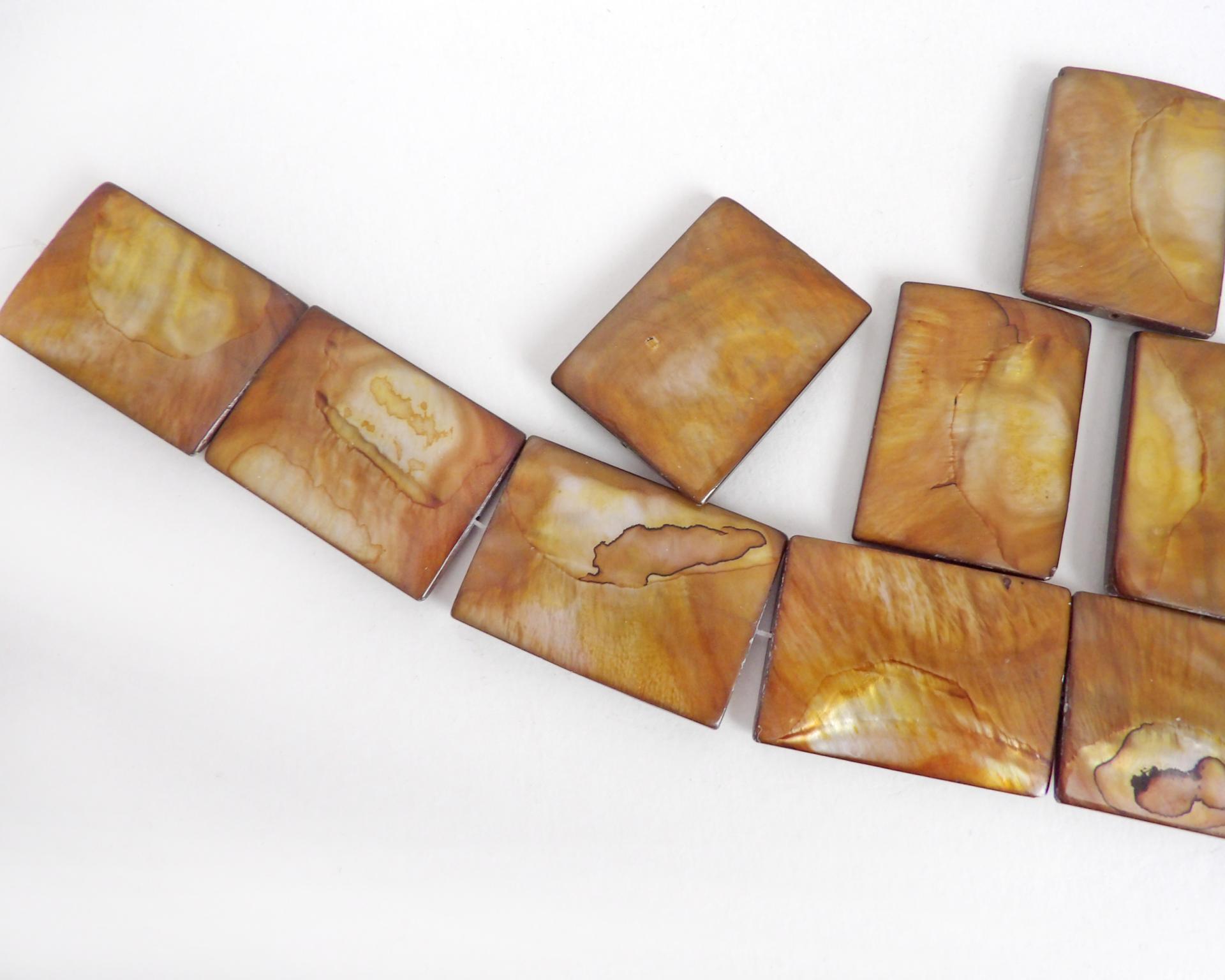 Beautiful Golden Mother of Pearl beads for jewelry making. Nice large rectangular size for pendants measuring approx. 1-3/8" in length and 1" width. Drilled top to bottom. Total of 10 pieces. 