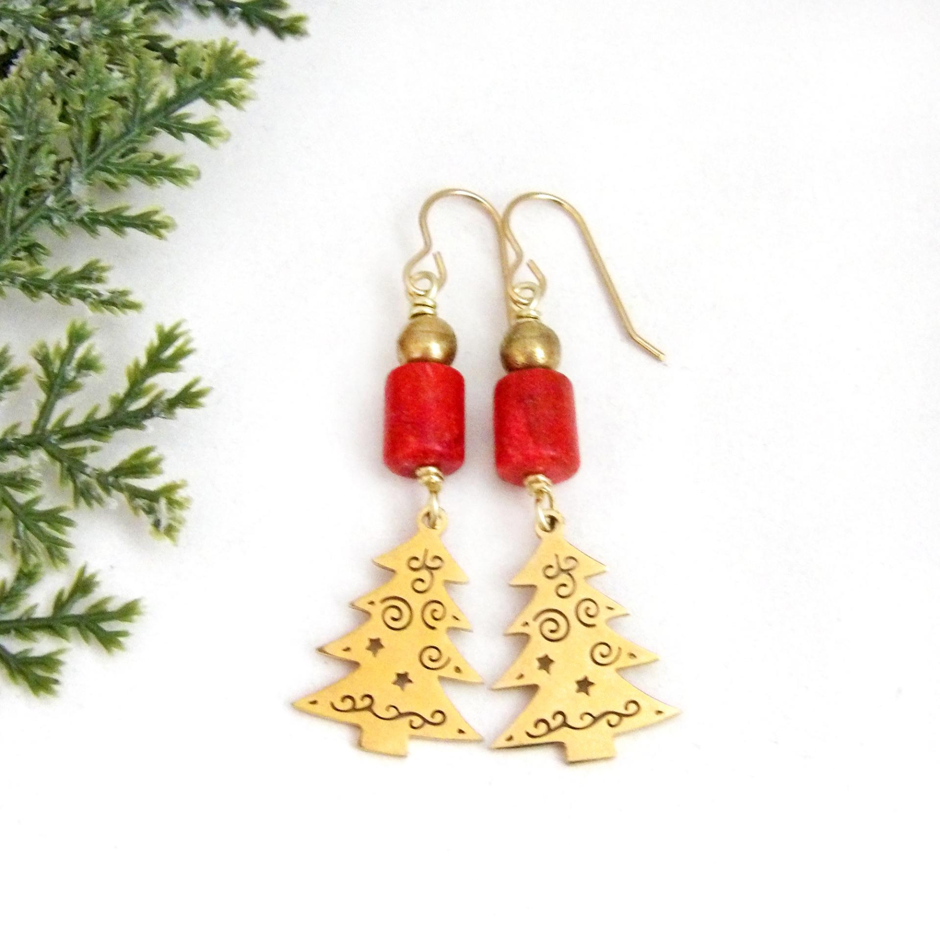 These handmade earrings feature 18K gold plated Christmas tree charms with a whimsical cut-out pattern of spirals and swirls. They are accented with red coral and gold brass beads. Full of holiday charm, they'll make a great Christmas / holiday gift for women of all ages. Earrings are lightweight and comfortable to wear. 