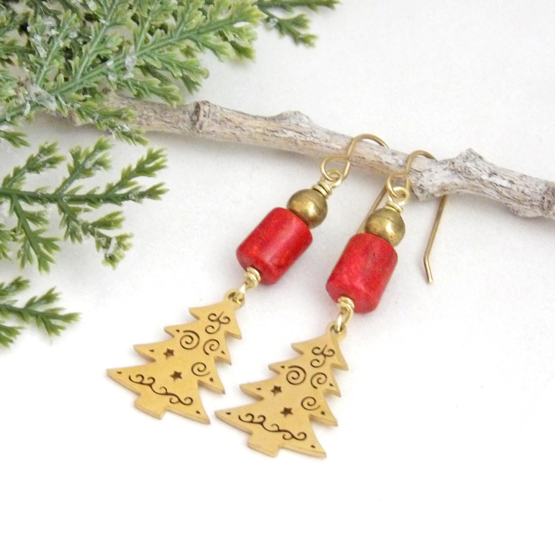 These handmade earrings feature 18K gold plated Christmas tree charms with a whimsical cut-out pattern of spirals and swirls. They are accented with red coral and gold brass beads. Full of holiday charm, they'll make a great Christmas / holiday gift for women of all ages. Earrings are lightweight and comfortable to wear. 