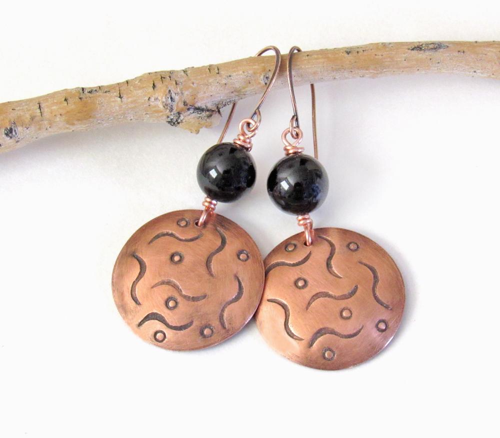 These handcrafted copper dangle earrings have a hand stamped texture and are accented with natural black onyx gemstones. They have a classic modern style that coordinates with all wardrobe types. They'll make a great gift for couples celebrating their 7th wedding anniversary - copper is the traditional metal and onyx is the traditional gemstone for this occasion.